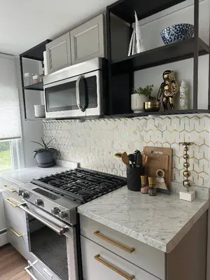 a kitchen with a stove and a counter top at 5 Min walk to Stony Brook University in Stony Brook