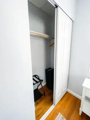 a hallway with a door open to a room at Sparkling Saratoga 3BR home near Track and SPAC Dogs in Saratoga Springs