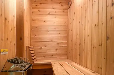 a sauna with a wooden paneled wall at Cozy Log Cabin Near Mt Snow Views, Modern Comfort in Wilmington