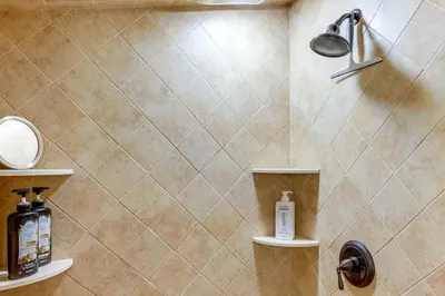a bathroom with a shower with soap and shampoo at Cozy Log Cabin Near Mt Snow Views, Modern Comfort in Wilmington