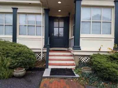 a front door of a house with a blue door at Roslyn Room 1 Private Bathroom in Roslyn