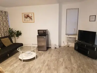 a living room with a couch and a coffee table at Roslyn Room 1 Private Bathroom in Roslyn