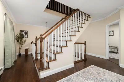 a staircase in a home with wooden floors at Family Oasis Pool Firepit Creek Near Delaware in Sparrow Bush
