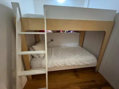 a small bunk bed in a small room at West Village Apartment Rent 30 days or more in New York