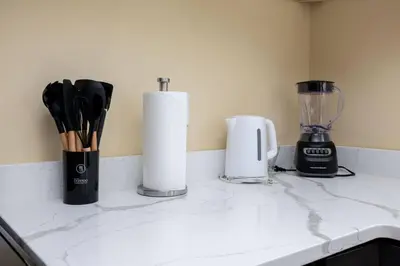 a kitchen counter with a blender and a counter top at Bright & Cozy Stay in the Heart of Hartford in Hartford