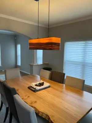a dining room with a wooden table and chairs at Saratoga Getaway in Saratoga Springs