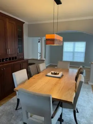 a dining room with a wooden table and chairs at Saratoga Getaway in Saratoga Springs