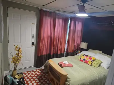 a bedroom with a bed with two pillows on it at Hidden and comfortable home away from home in Manchester