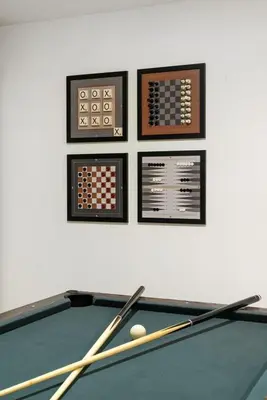 a billiard table with three cues on top of it at Cozy Poconos Retreat - pool table, hot tub, fire pit in Tobyhanna
