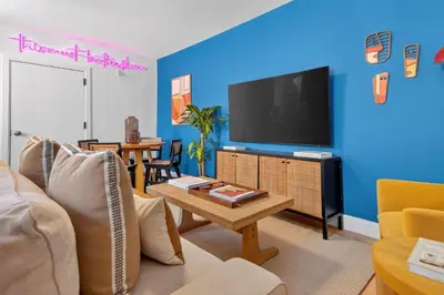 a living room with a couch and a tv at Spacious 3Bedroom with AC near McCarren Park Brooklyn Stay in Brooklyn