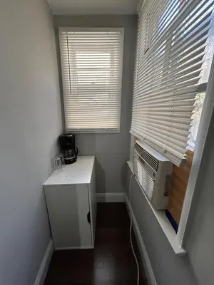 a small room with a heater and a window at Roslyn Room 2 Private Entrance and Bathroom in Roslyn