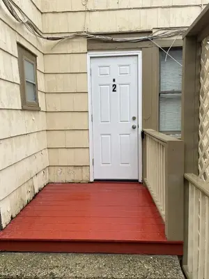 a white door with a red mat in front of a building at Roslyn Room 2 Private Entrance and Bathroom in Roslyn