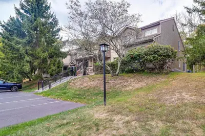 a street light in the grass in front of a house at Family Gem with Deck Across From Shawnee Mountain! in East Stroudsburg