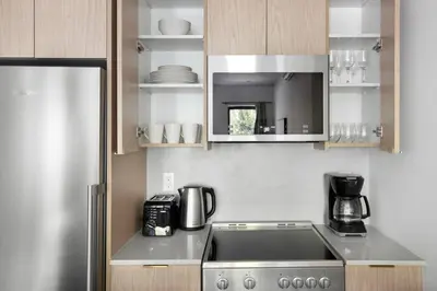 a kitchen with a sink and a counter top at Blueground Greenpoint view nr McGolrick Park NYC-2071 in Brooklyn
