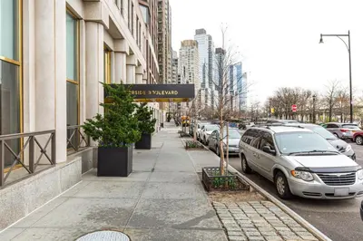 a sidewalk in a city with cars parked at Blueground Lincoln Square fitness center nr Riverside Park NYC-846 in New York