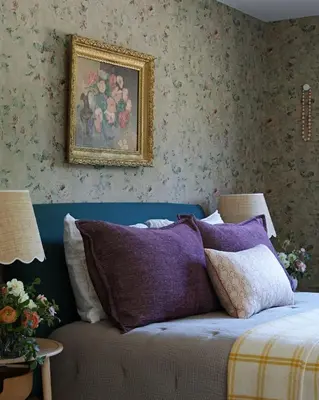 a bedroom with a bed with purple pillows and a painting at Argyll House by Boutique Litchfield Escape Villa in Harwinton