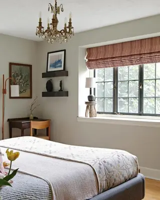a bedroom with a bed with a chandelier and a window at Argyll House by Boutique Litchfield Escape Villa in Harwinton