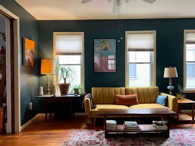 a living room with a couch and a table at Sunny & spacious pied-à-terre by Union & Proctors! in Schenectady
