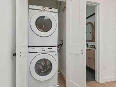 a laundry room with a washer and dryer at Modern living on the Quinnipiac River in New Haven