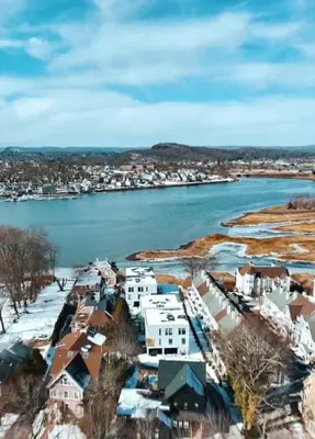 an aerial view of a city and a river with houses at Modern living on the Quinnipiac River in New Haven