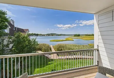 a balcony with a view of a river at Modern living on the Quinnipiac River in New Haven