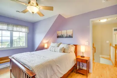 a bedroom with a bed and a ceiling fan at New Milford Home 29 Mi to Lime Rock Park! in New Milford
