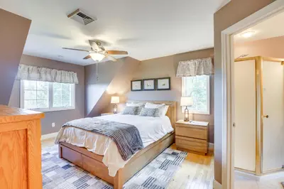 a bedroom with a bed and a ceiling fan at New Milford Home 29 Mi to Lime Rock Park! in New Milford