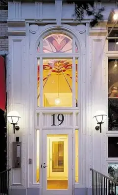 a yellow door with a window on a building at 19-4G 2BR 2Baths Luxury Apt East Village in New York