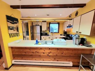 a kitchen with a sink and a counter top at Shawnee Ski Mountain View Jacuzzi Townhouse in East Stroudsburg