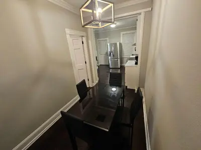 a dining room with a table and a refrigerator at Apartment in Middletown-Wesleyan102 in Middletown