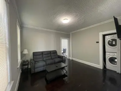 a living room with a couch and a washing machine at Apartment in Middletown-Wesleyan102 in Middletown