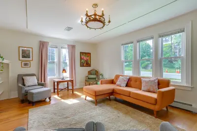 a living room with a couch and a chair at Walk to Hudson River Waterfront Newburgh Home in Newburgh
