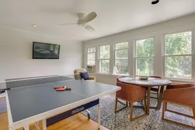 a living room with a table and chairs at Walk to Hudson River Waterfront Newburgh Home in Newburgh