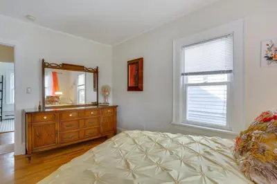 a bedroom with a dresser and a mirror at Walk to Hudson River Waterfront Newburgh Home in Newburgh