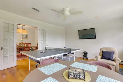 a living room with a ping pong table at Walk to Hudson River Waterfront Newburgh Home in Newburgh