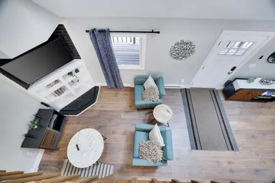 an overhead view of a living room with blue furniture at Winter retreat, hot tub, game room, indoor pool, in Long Pond