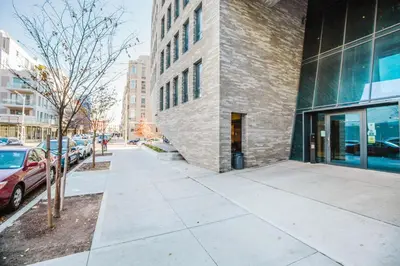 a sidewalk in front of a brick building at Blueground Williamsburg rooftop nr McCarren Park NYC-2076 in Brooklyn