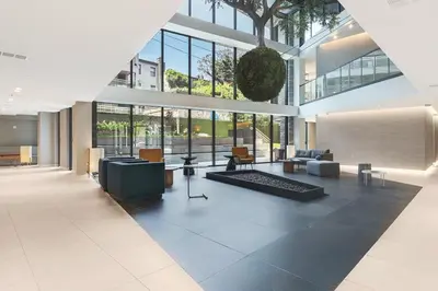 a large lobby with a large building with windows at Blueground Williamsburg rooftop nr McCarren Park NYC-2076 in Brooklyn