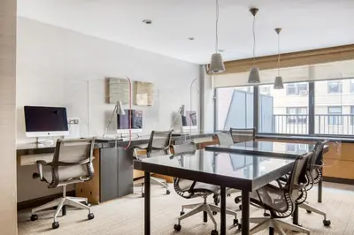 an office with a conference room with a table and chairs at Blueground Upper West Side fitness nr Central Park NYC-1994 in New York