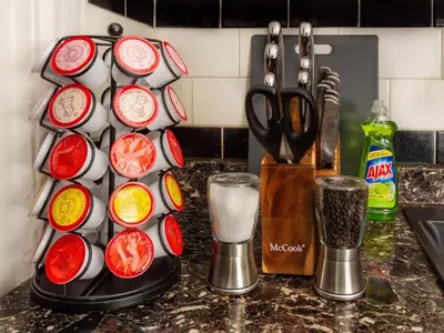 a kitchen counter with a bunch of cups and scissors at Spacious 1 bedroom Downtown in Albany