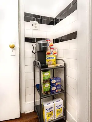 a kitchen pantry with a cart of food at Spacious 1 bedroom Downtown in Albany