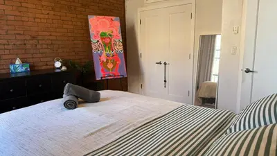 a bedroom with a bed and a painting on the wall at ROOM IN WILLIAMBURG IN A 2BEDROOMS APt in Brooklyn