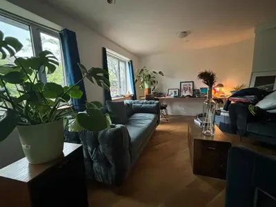 a living room with a couch and a table at 1 BEDROOM WITH SLEEPING IN LIVING ROOM Williamburg in Brooklyn