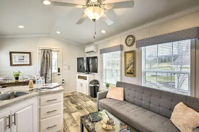 a living room with a couch and a kitchen at Premium Cottages And Suites At Equestrian House in Pleasant Mount