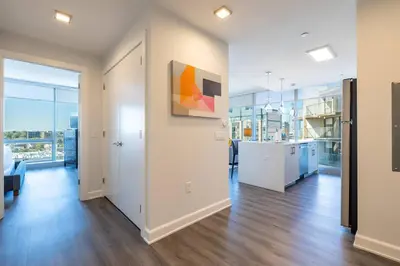 an empty room with a painting on the wall at Chic Stamford Apartment - Walk to Train & Entertainment in Stamford