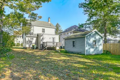 an empty yard with a house and a shed at Walk to Main Street! Updated Norwich Home in Norwich