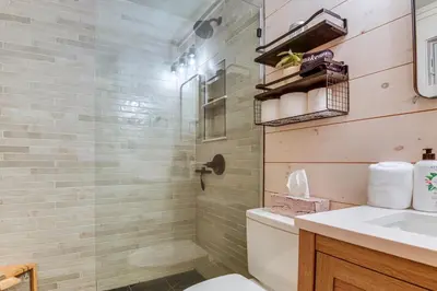a bathroom with a shower and a toilet and a sink at Hike, Ski and Relax Renovated Retreat in Wilmington in Wilmington