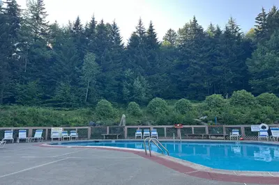 a large swimming pool with chairs at Hike, Ski and Relax Renovated Retreat in Wilmington in Wilmington