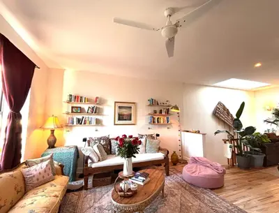 a living room with a couch and a table at Luxurious bedroom in New York