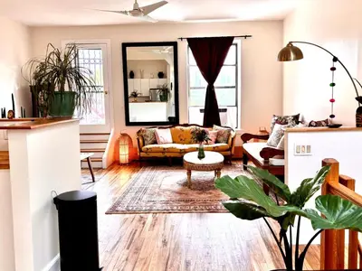 a living room with a couch and a table at Luxurious bedroom in New York